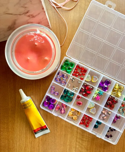 Bedazzle Candle Kit with a scented candle, decorative beads and glue